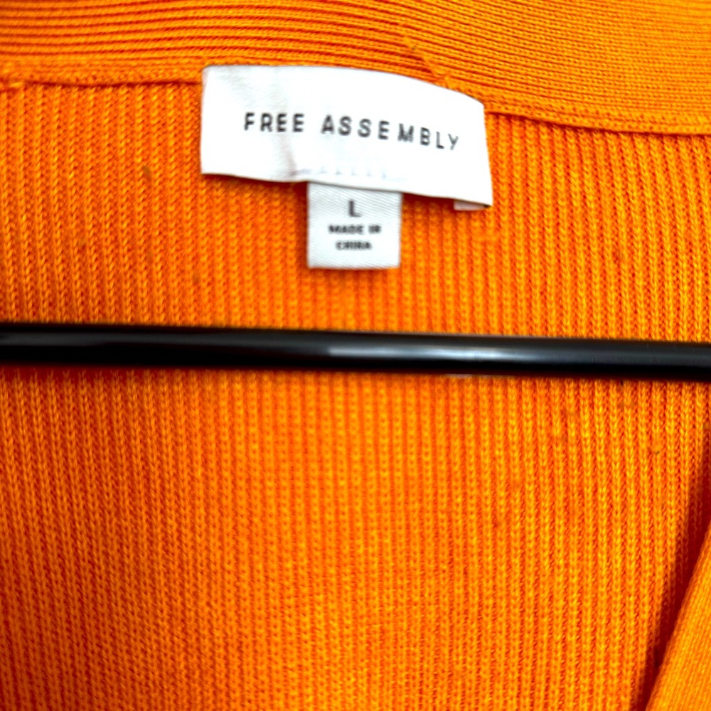 Bright orange cardigan, button front with front pockets